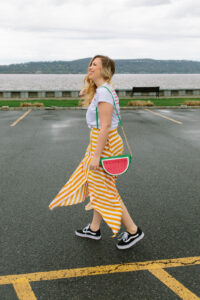 How to Dress Down a Midi Skirt Topshop Button Handkerchief Hem Midi Striped Skirt Watermelon Purse Bag Vans Old Skool Sneakers